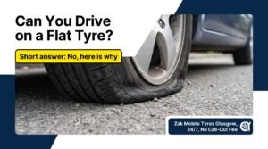 Completely flat car tyre on the road in Glasgow before a mobile tyre replacement callout