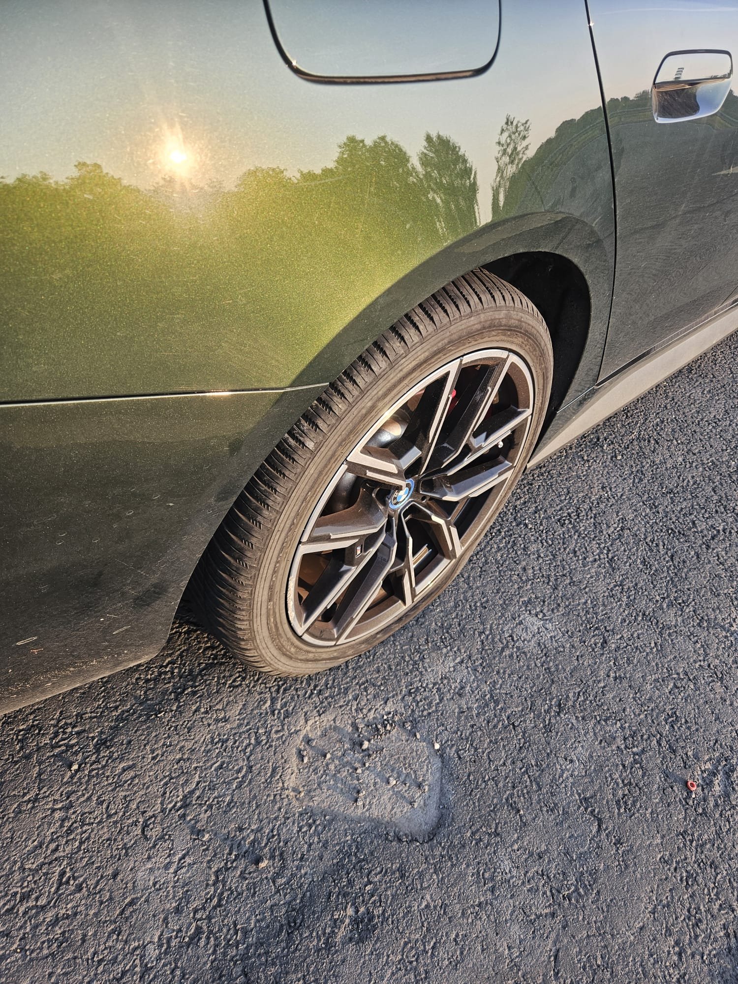 Technician checking tyre pressure and torque after mobile tyre fitting